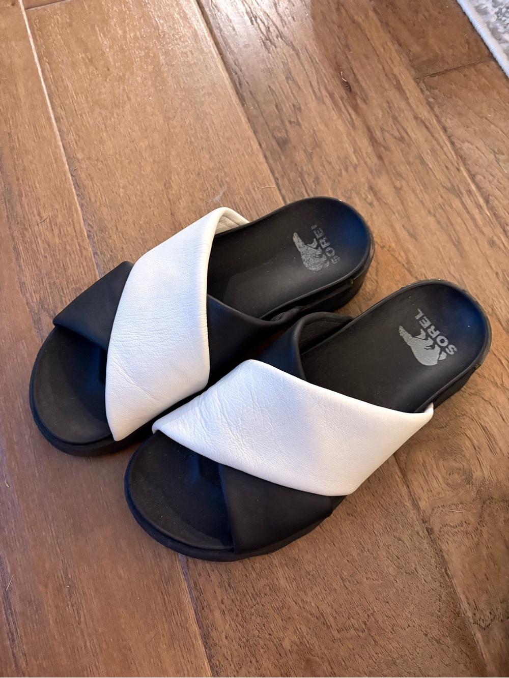 Sorel Women’s Black and White Crisscross Slide Sandals